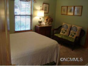 181 Caledonia Road Landrum, SC 29356 - Photo 15 of 24 a bedroom with a bed and window
