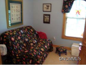 181 Caledonia Road Landrum, SC 29356 - Photo 20 of 24 a bedroom with a bed and a window