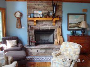 181 Caledonia Road Landrum, SC 29356 - Photo 4 of 24 a living room with furniture and a fireplace