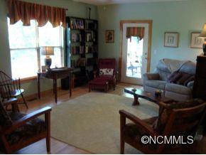 181 Caledonia Road Landrum, SC 29356 - Photo 8 of 24 a living room with furniture window and potted plant