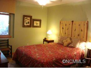 181 Caledonia Road Landrum, SC 29356 - Photo 9 of 24 a bedroom with a bed and a window