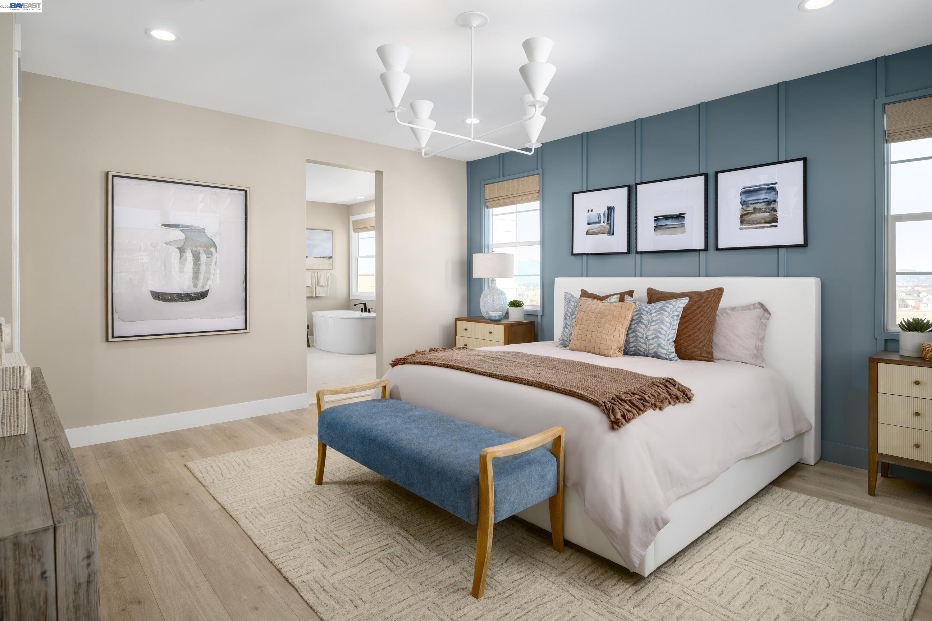 3820 Hereford Road Dublin, CA 94568 - Photo 19 of 22 a bedroom with a large bed and a chandelier