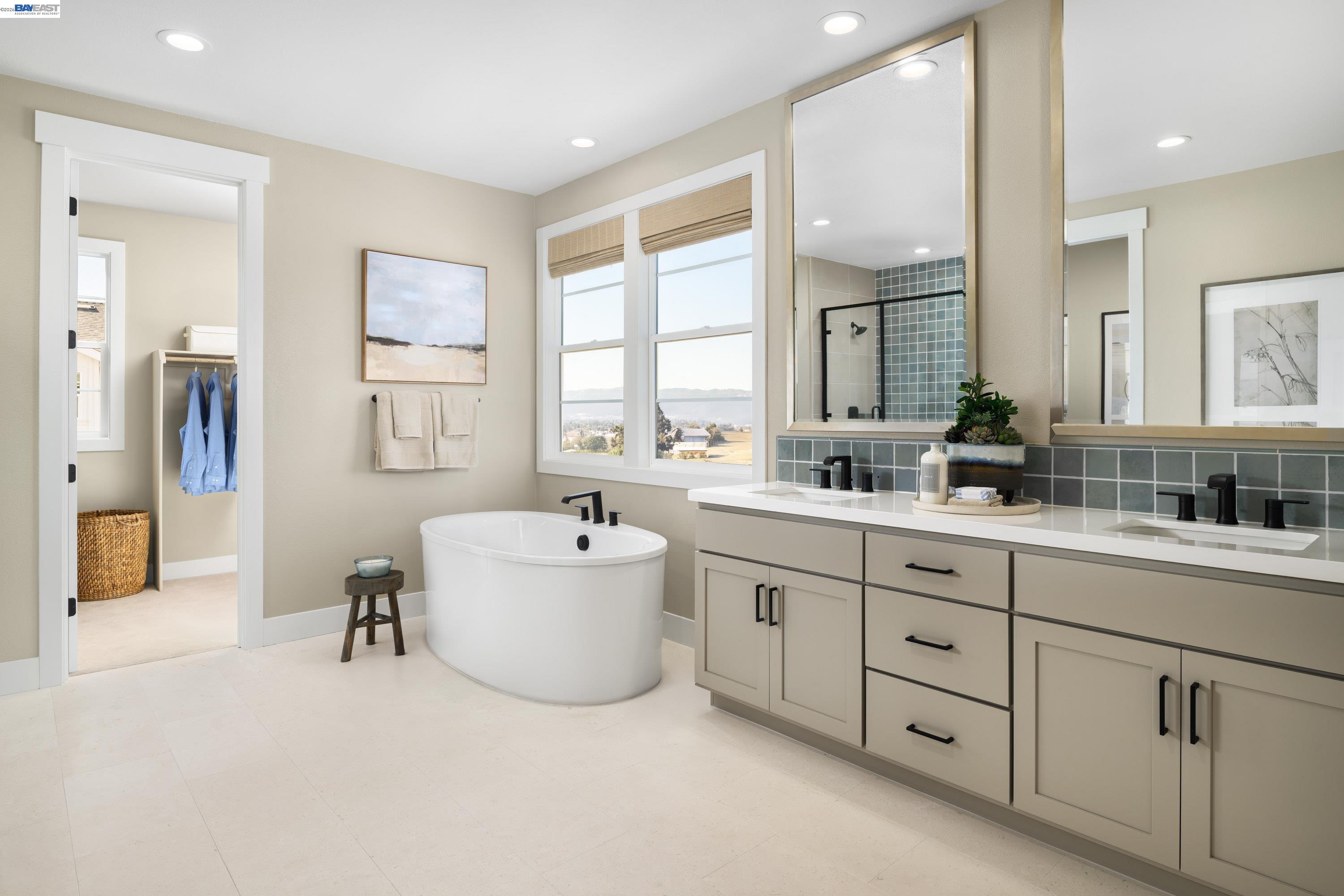 3820 Hereford Road Dublin, CA 94568 - Photo 21 of 22 a bathroom with a tub sink double vanity mirror and window