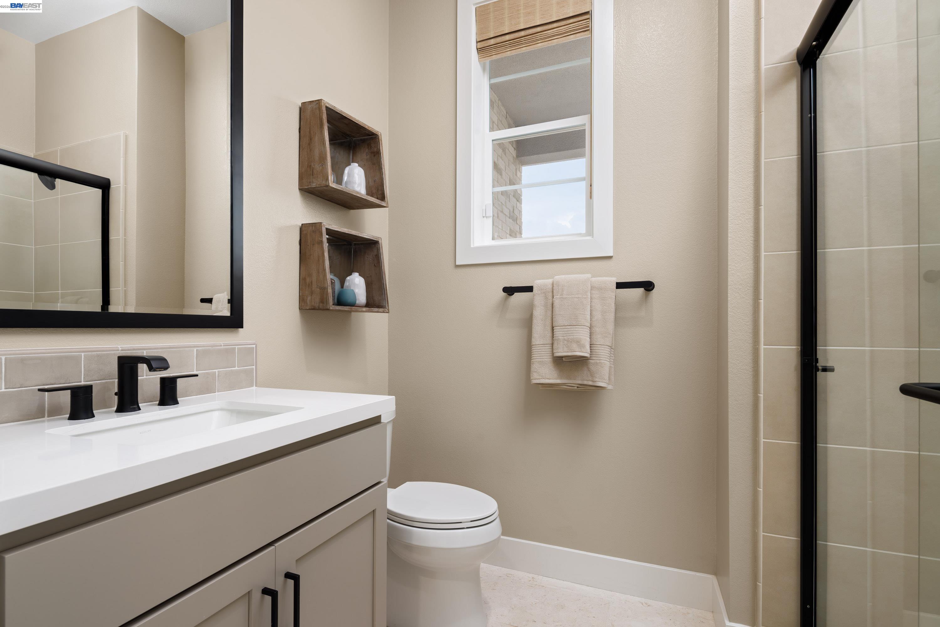 3820 Hereford Road Dublin, CA 94568 - Photo 8 of 22 a bathroom with a toilet sink and mirror