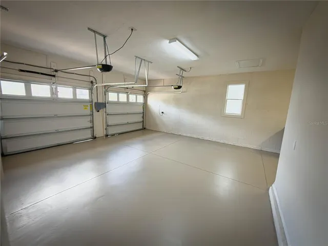 an empty room with a wooden door