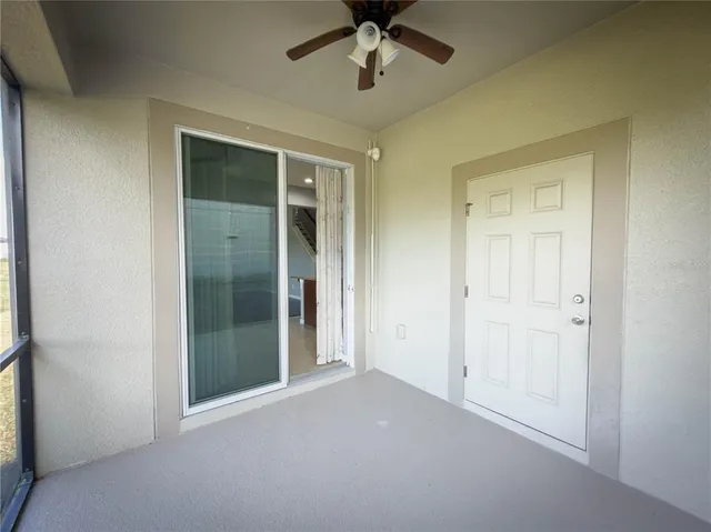 a view of a room with window and wooden floor
