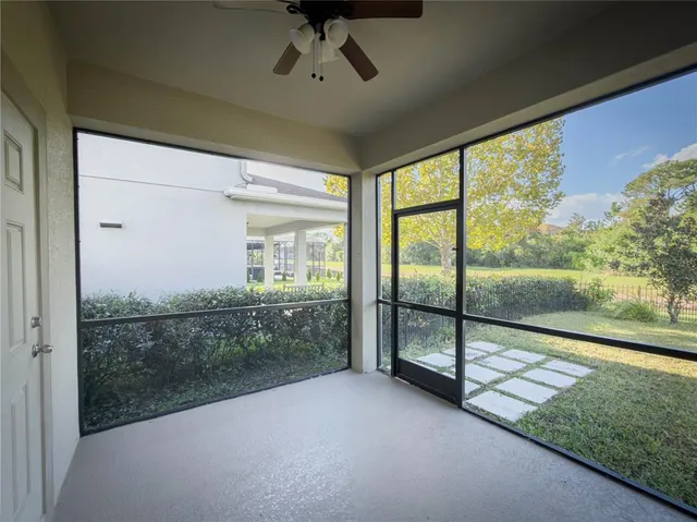 a large kitchen with stainless steel appliances kitchen island granite countertop a refrigerator and a stove top oven