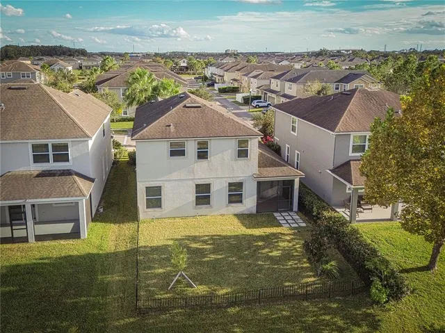 an aerial view of a house with a garden