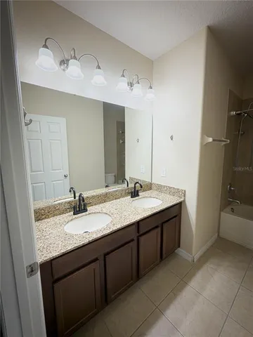 a view of a big room with wooden floor and closet