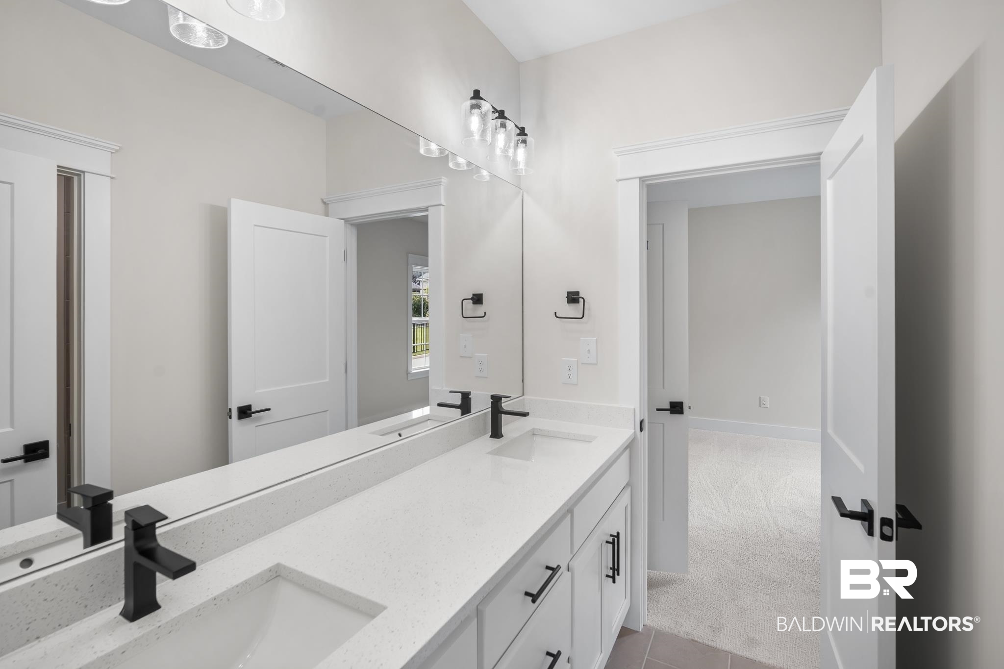 21826 Veranda Boulevard Fairhope, AL 36532 - Photo 26 of 42 Bathroom featuring light carpet, double vanity, and light tile patterned floors