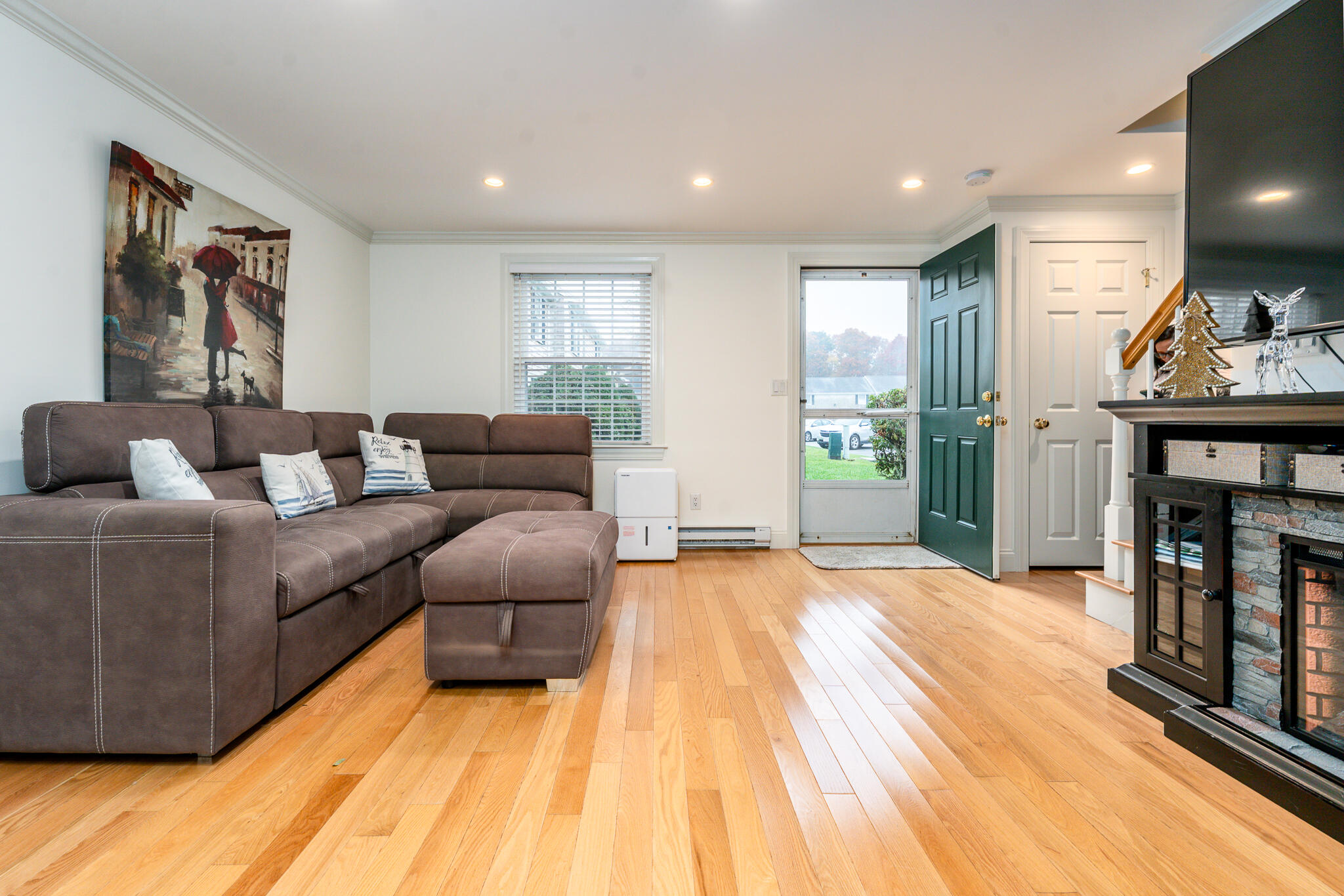 135 West Main Street, Unit 45 Hyannis, MA 02601 - Photo 11 of 23 a living room with furniture and a fireplace