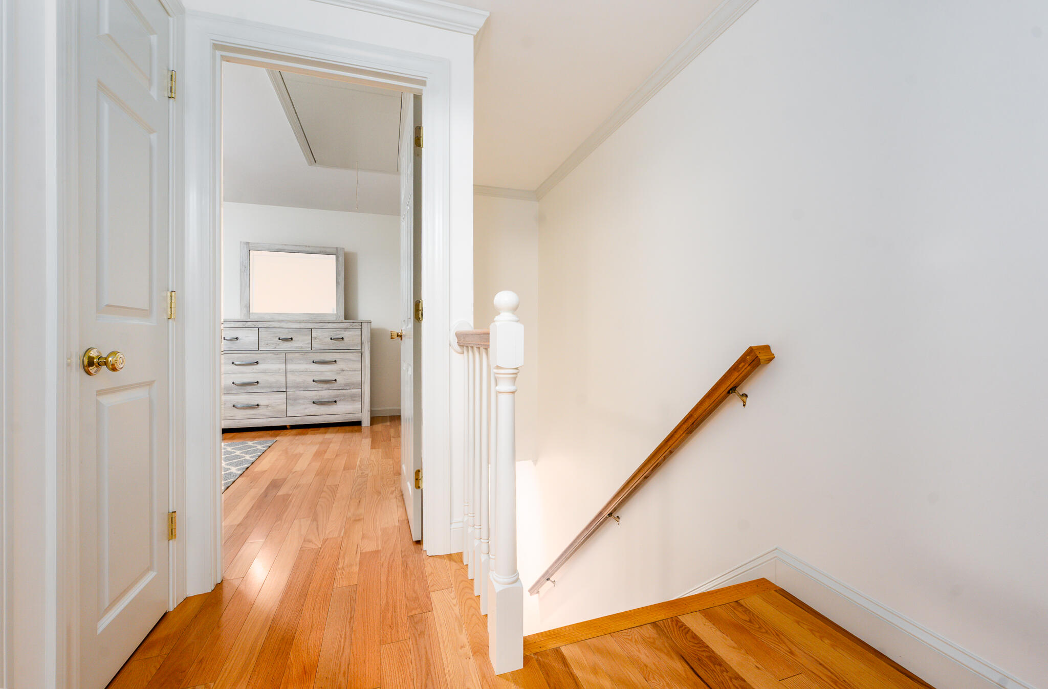 135 West Main Street, Unit 45 Hyannis, MA 02601 - Photo 15 of 23 a view of a hallway with wooden floor and staircase