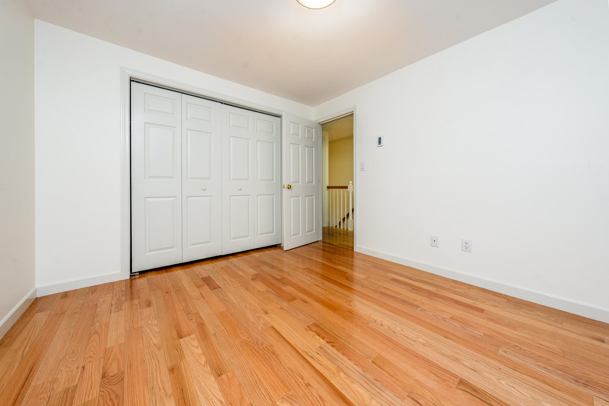 135 West Main Street, Unit 45 Hyannis, MA 02601 - Photo 19 of 23 a view of an empty room and wooden floor