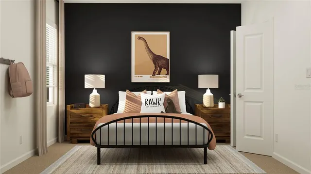 a bed sitting in a bedroom next to a mirror