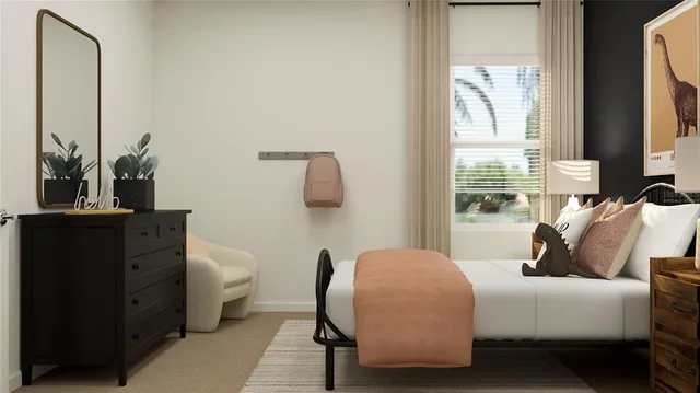 a bedroom with a bed and a flat tv screen on dresser