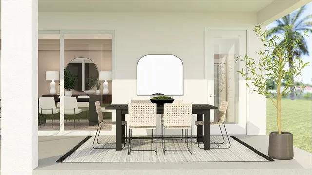 a view of living room filled with furniture and a potted plant