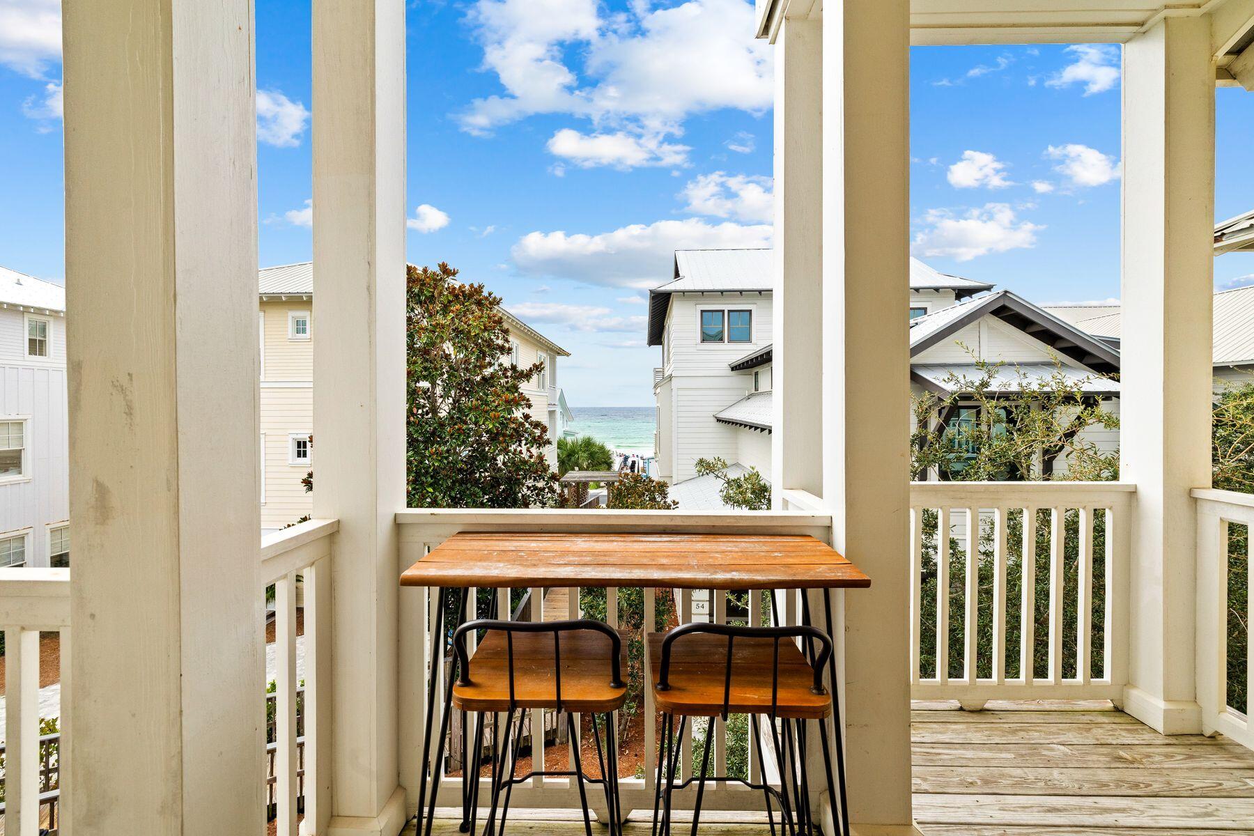 48 Chelsea Loop Road Santa Rosa Beach, FL 32459 - Photo 13 of 37 a view of a balcony with a door and a chair