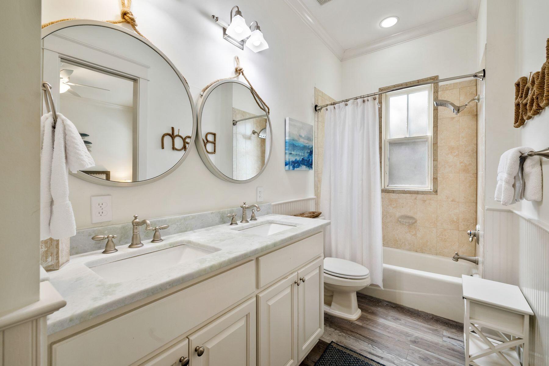 48 Chelsea Loop Road Santa Rosa Beach, FL 32459 - Photo 19 of 37 a bathroom with a granite countertop sink mirror toilet and bathtub