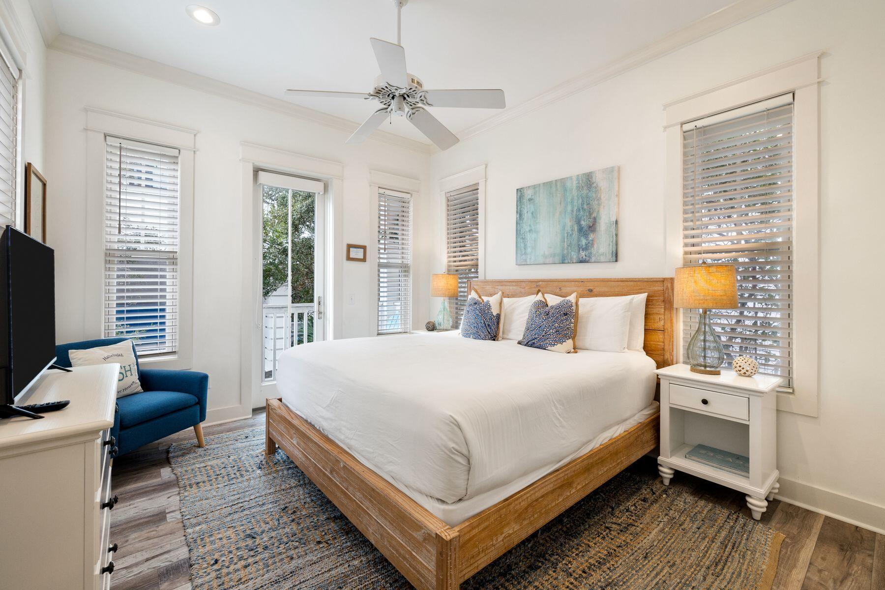 48 Chelsea Loop Road Santa Rosa Beach, FL 32459 - Photo 21 of 37 a bedroom with a bed and a flat tv screen on dresser