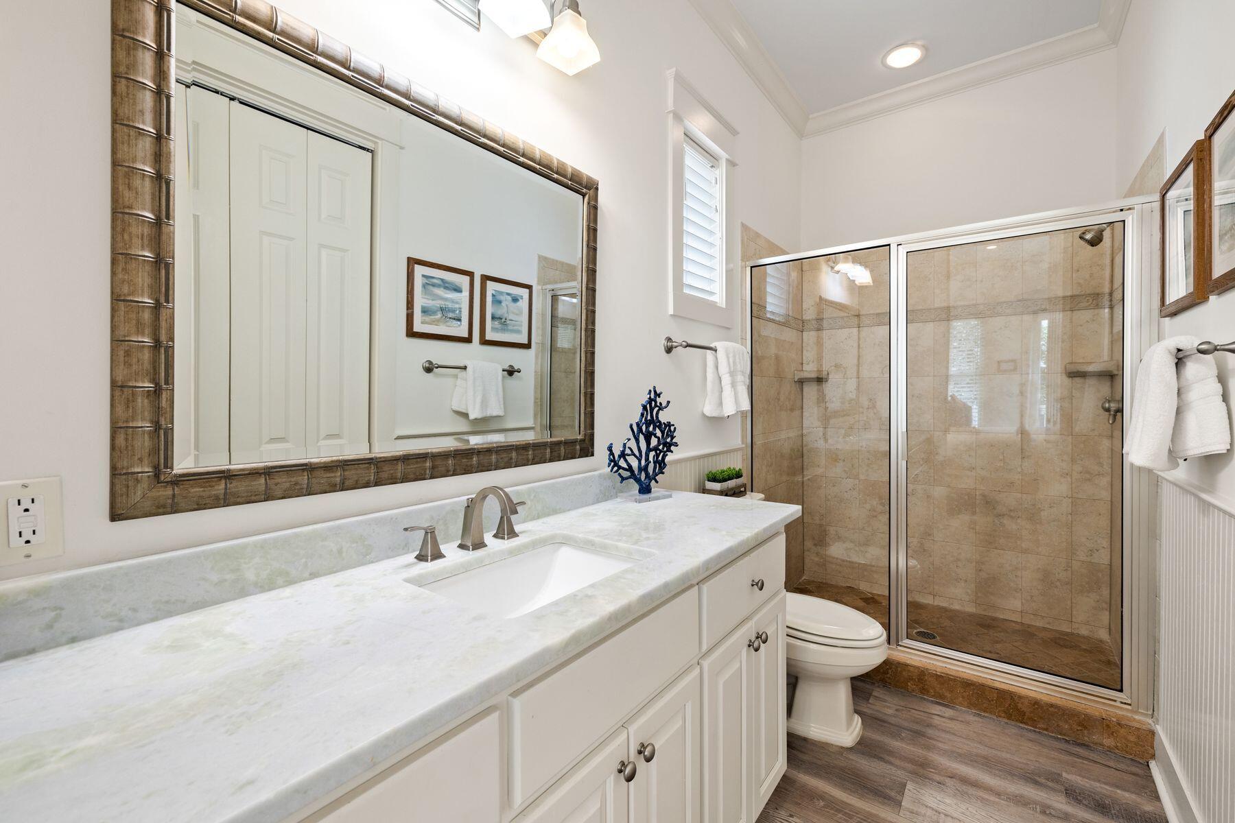 48 Chelsea Loop Road Santa Rosa Beach, FL 32459 - Photo 22 of 37 a bathroom with a sink a toilet and shower