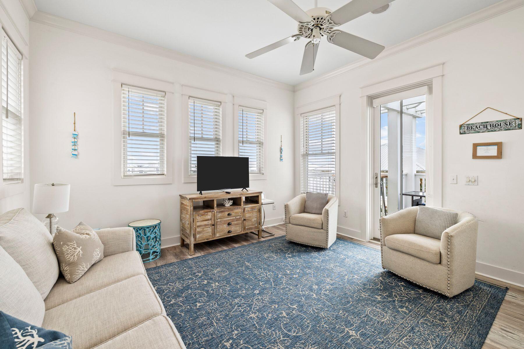 48 Chelsea Loop Road Santa Rosa Beach, FL 32459 - Photo 25 of 37 a living room with furniture and a flat screen tv
