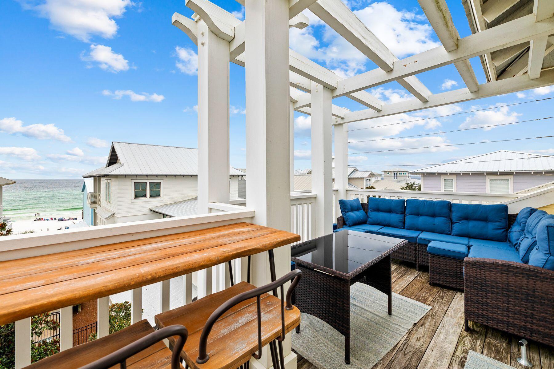 48 Chelsea Loop Road Santa Rosa Beach, FL 32459 - Photo 27 of 37 a outdoor living space with furniture and a potted plant