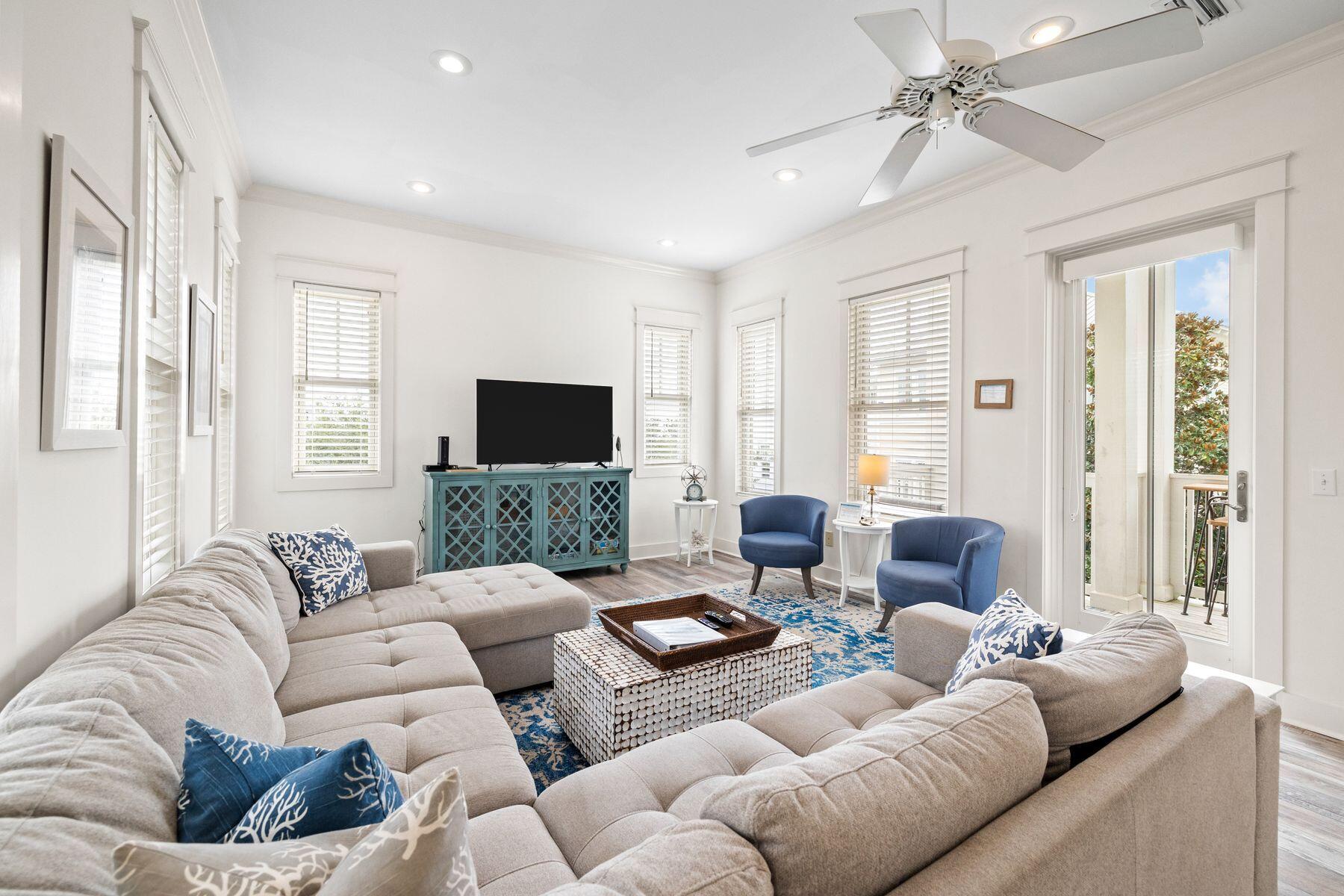 48 Chelsea Loop Road Santa Rosa Beach, FL 32459 - Photo 10 of 37 a living room with furniture ceiling fan and a flat screen tv