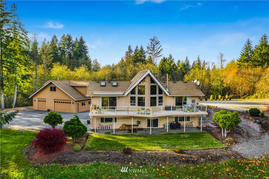 5130 165th Lane Southwest Rochester, WA 98579 - Photo 2 of 25 a front view of a house with a garden