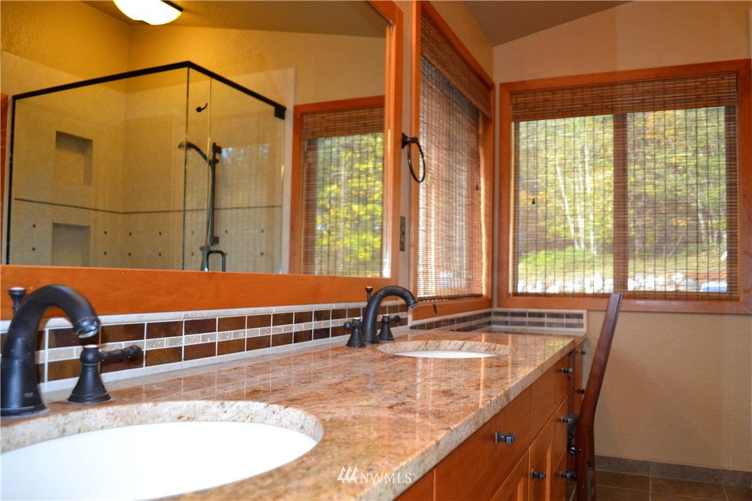 5130 165th Lane Southwest Rochester, WA 98579 - Photo 15 of 25 a view of a swimming pool with a lounge chair