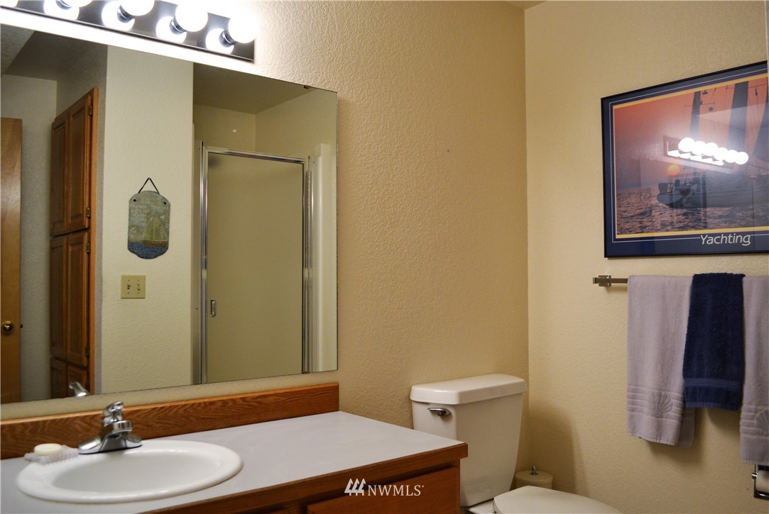 5130 165th Lane Southwest Rochester, WA 98579 - Photo 18 of 25 a bathroom with a sink and a mirror