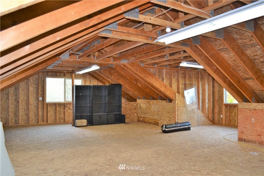 5130 165th Lane Southwest Rochester, WA 98579 - Photo 23 of 25 a view of a room with wooden walls and stairs