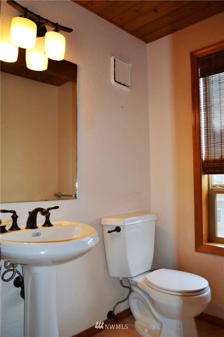 5130 165th Lane Southwest Rochester, WA 98579 - Photo 7 of 25 a bathroom with a sink and a toilet