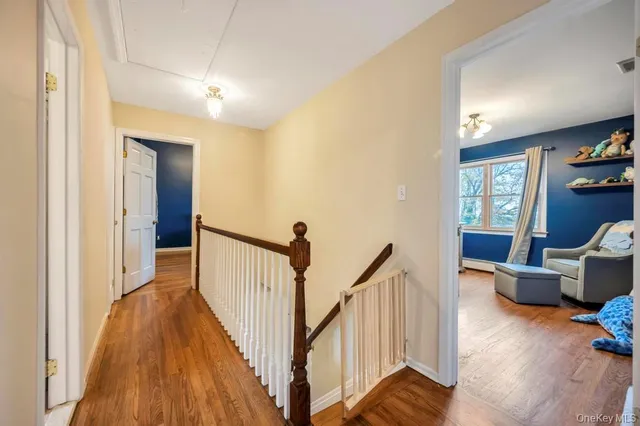 a view of a livingroom with furniture and staircase