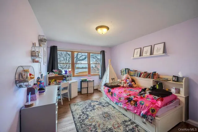 a bed room with a bed and a window