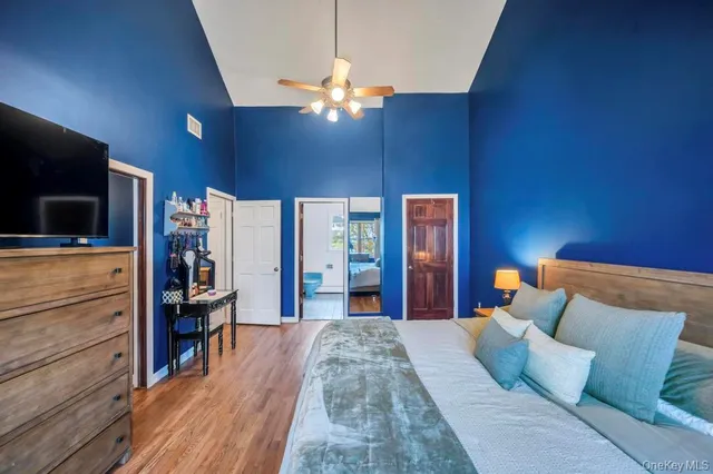 a bed room with a bed and a television