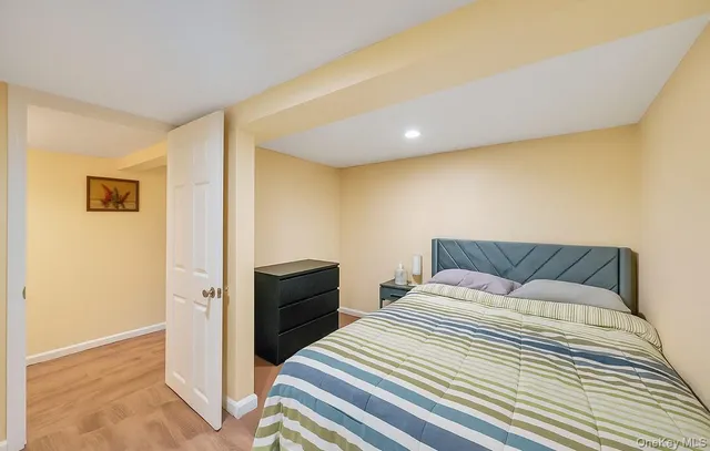 a bedroom with a bed and a dresser