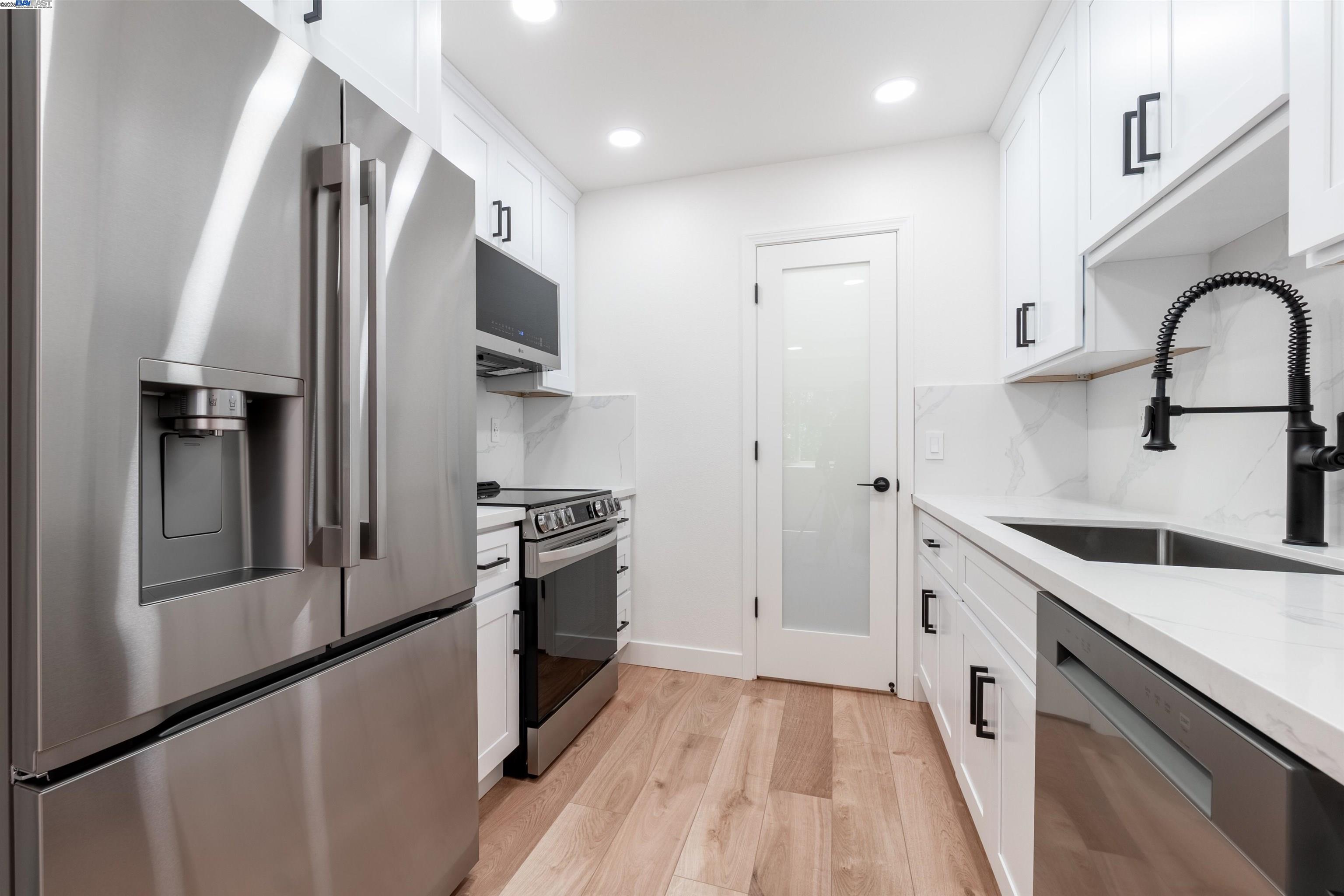 373 Caliente Circle San Leandro, CA 94578 - Photo 1 of 1 a kitchen with granite countertop a refrigerator stove and sink