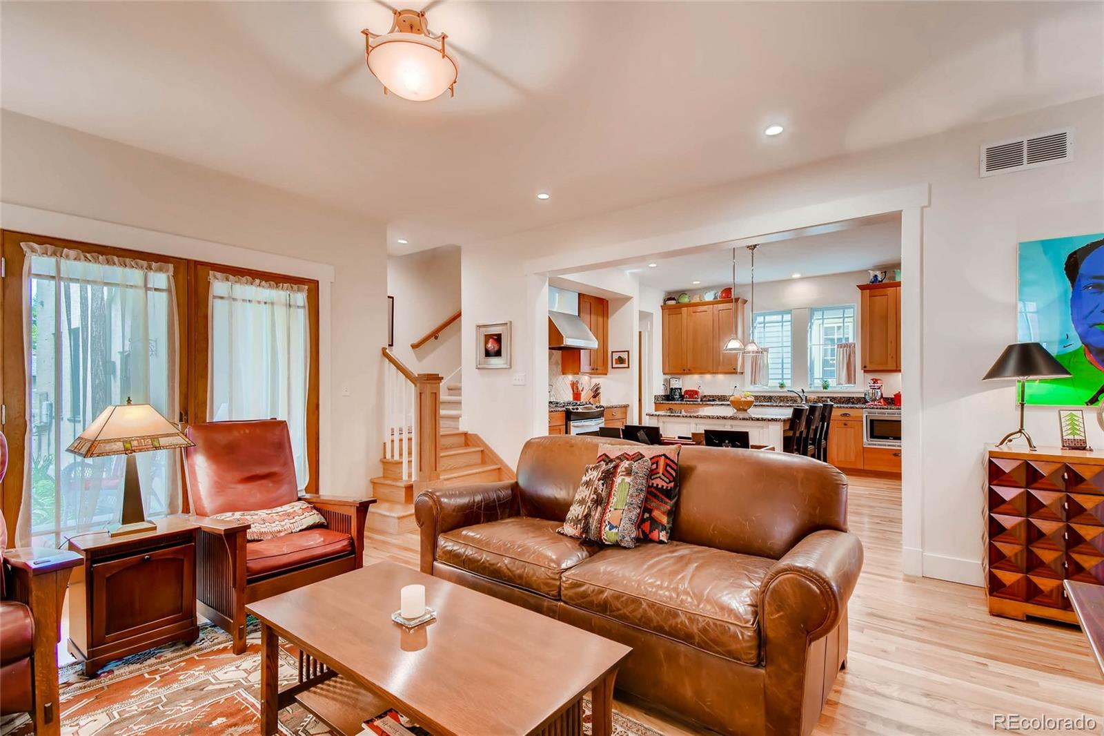 11770 Perry Street Westminster, CO 80031 - Photo 12 of 28 a living room with furniture and a lamp