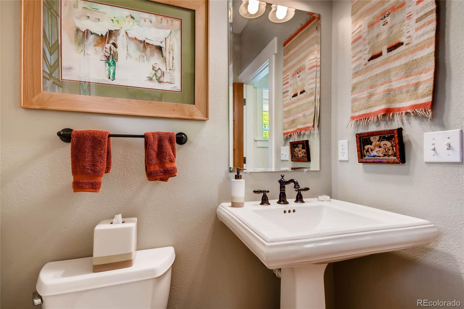 11770 Perry Street Westminster, CO 80031 - Photo 13 of 28 a bathroom with a sink and a mirror