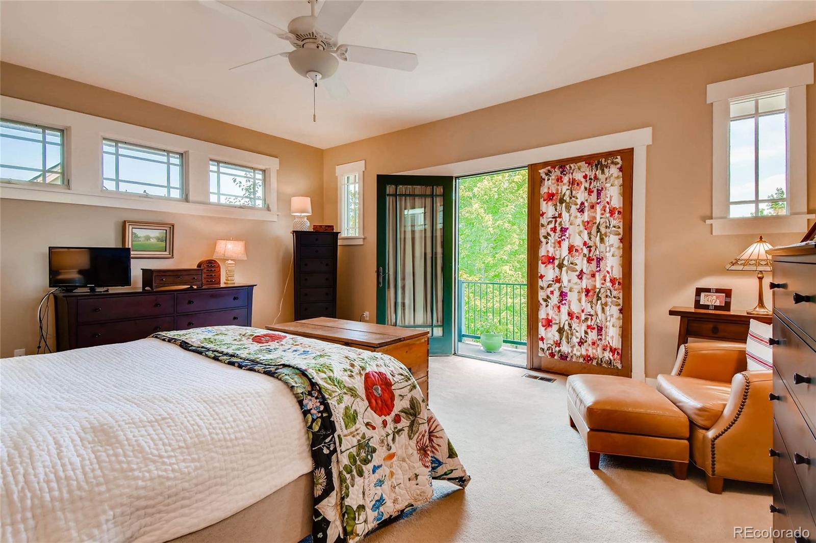 11770 Perry Street Westminster, CO 80031 - Photo 14 of 28 a bedroom with a bed and glass windows