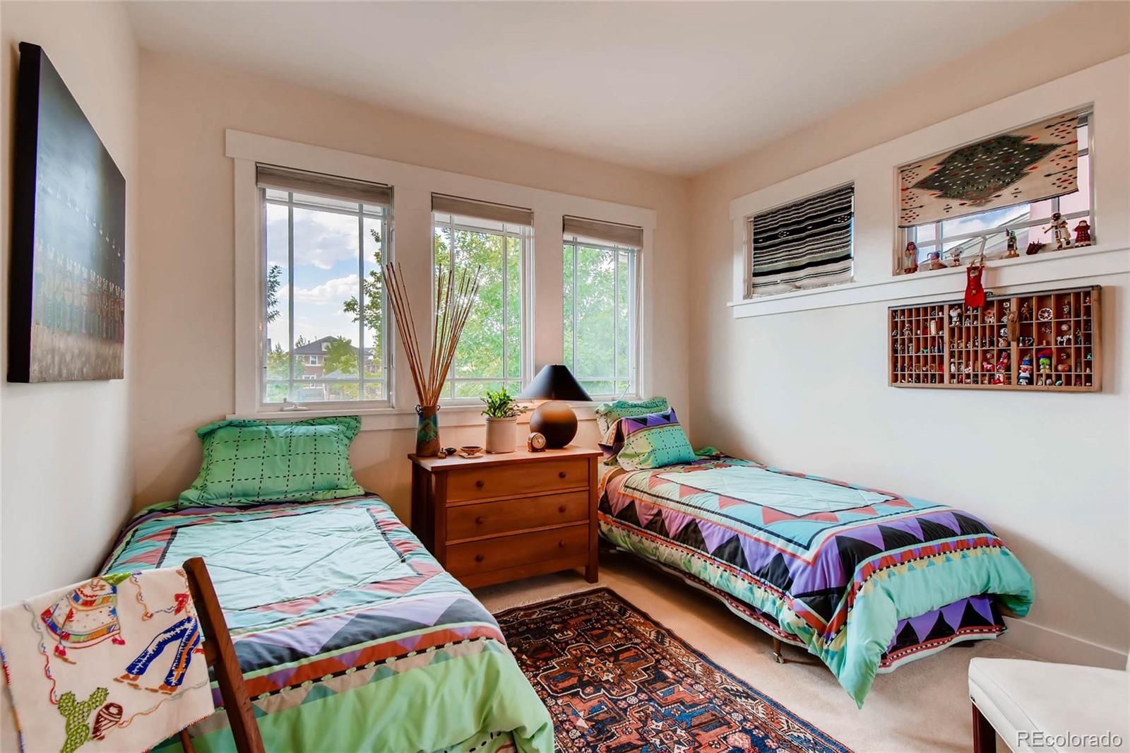 11770 Perry Street Westminster, CO 80031 - Photo 20 of 28 a bedroom with a bed and a window