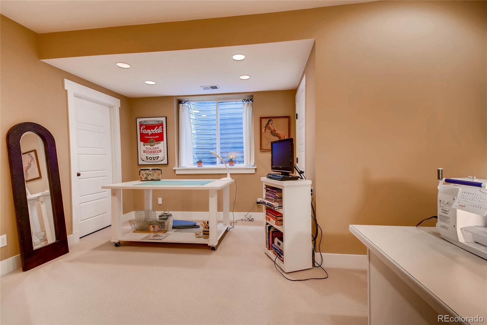 11770 Perry Street Westminster, CO 80031 - Photo 23 of 28 a room with a table and a couch