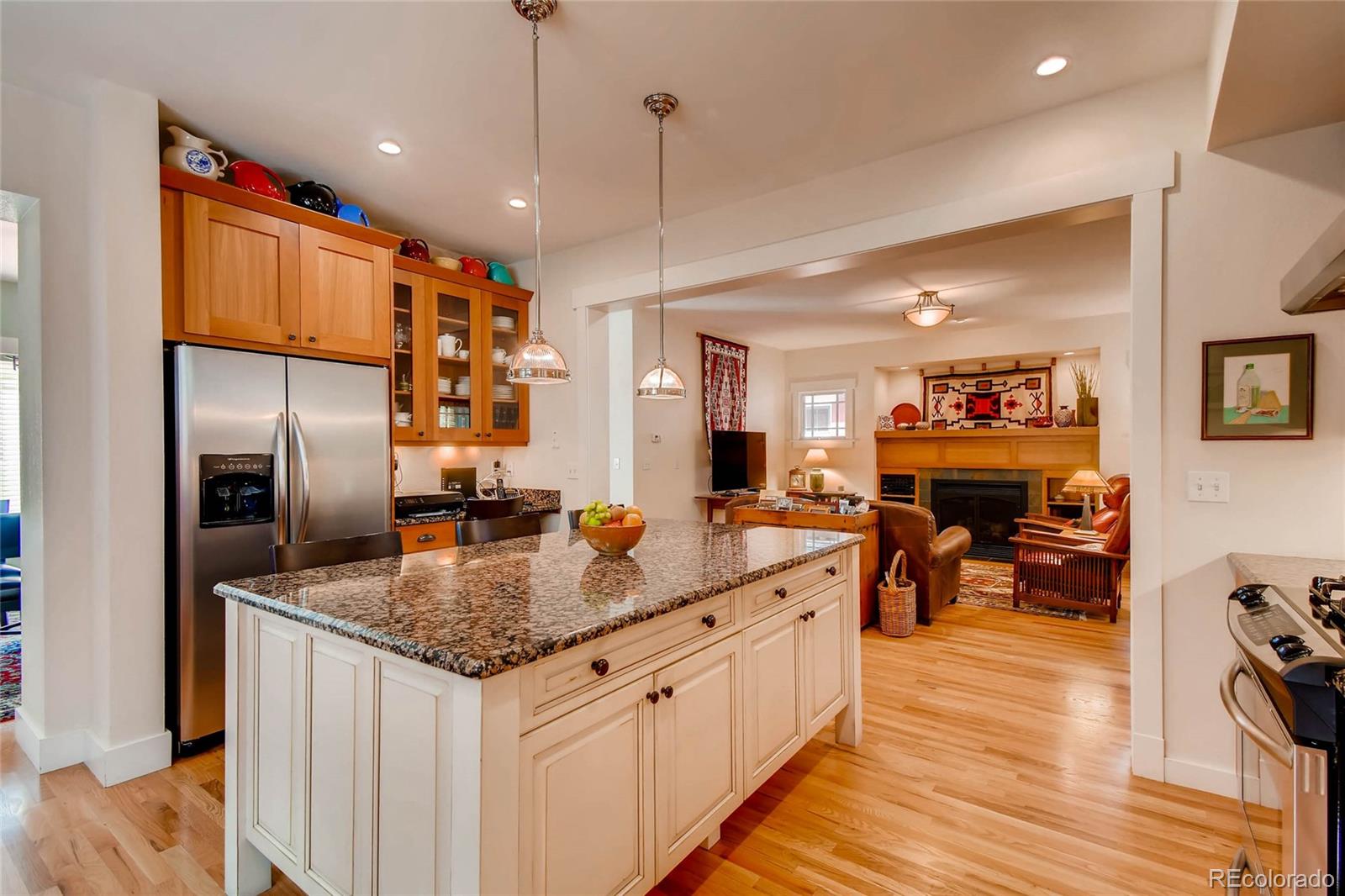 11770 Perry Street Westminster, CO 80031 - Photo 9 of 28 a kitchen with stainless steel appliances granite countertop a sink refrigerator and cabinets