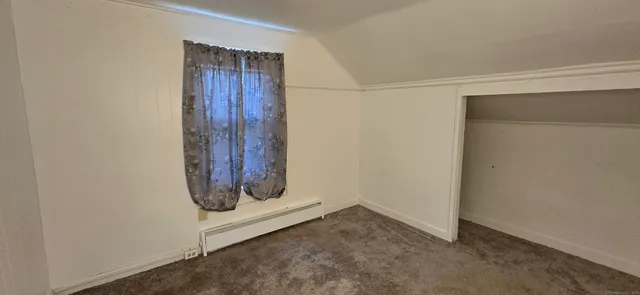 an empty room with wooden door