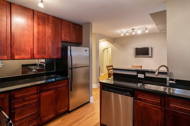 72 Pine Avenue, Unit GDN Riverside, IL 60546 - Photo 6 of 10 a kitchen with a refrigerator and a sink