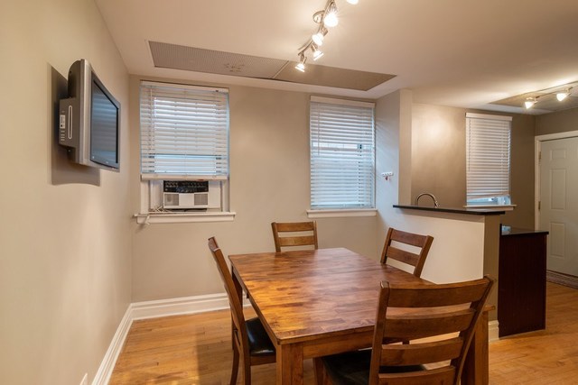 72 Pine Avenue, Unit GDN Riverside, IL 60546 - Photo 7 of 10 a dining room with furniture and window