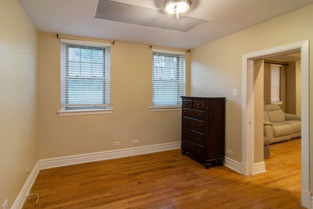 72 Pine Avenue, Unit GDN Riverside, IL 60546 - Photo 8 of 10 a view of an empty room with closet and wooden floor