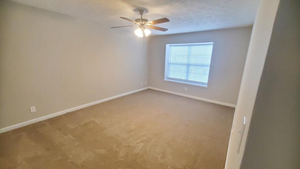 307 Adair Street, Unit B7 Decatur, GA 30030 - Photo 8 of 12 an empty room with windows and fan