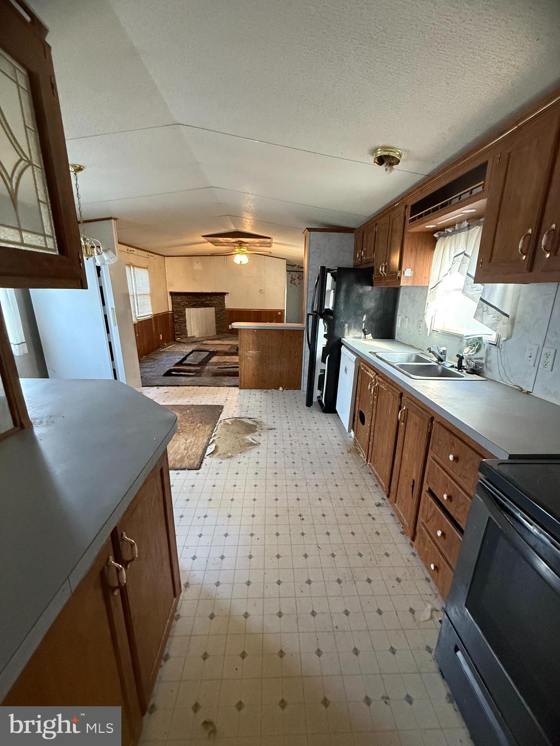 501 Windy Hill Road Shermans Dale, PA 17090 - Photo 5 of 13 a kitchen with sink refrigerator and stove