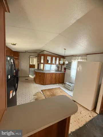 a view of kitchen with furniture and wooden floor